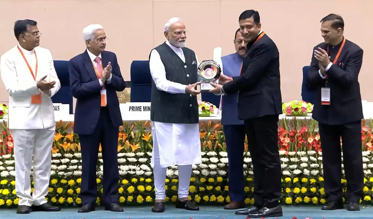 PM Fetes Adilabad Collector Rajarshi Shah