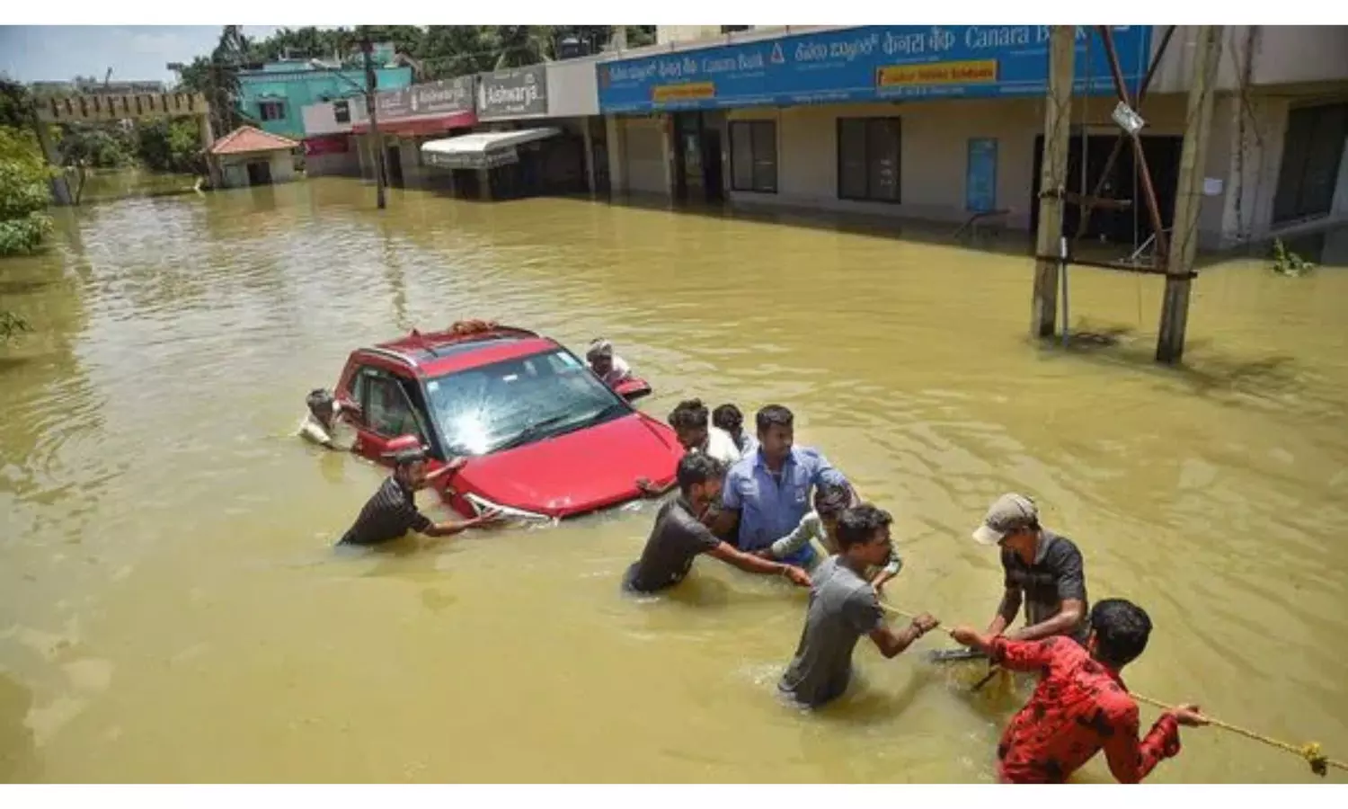 Indira Nagar Residents Protest By Sitting on Chairs On a Flooded Road Reading Newspaper with Tea