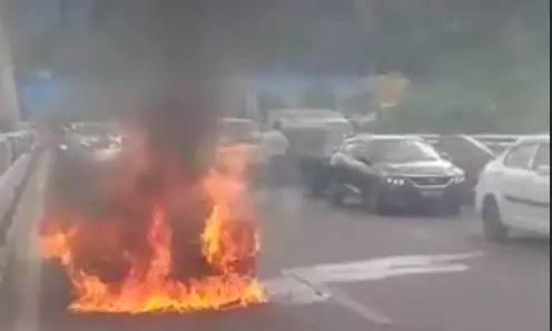 Car Gutted On Durgam Cheruvu Bridge