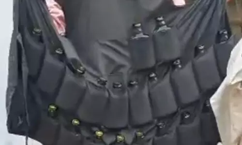 Adilabad: 32 Country Liquor Bottles Found in Bootlegger’s Jacket