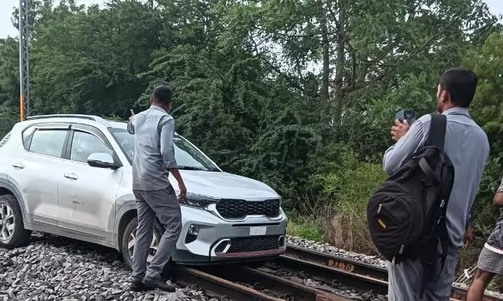 Woman Drives Car on Railway Tracks in Chevella, Held