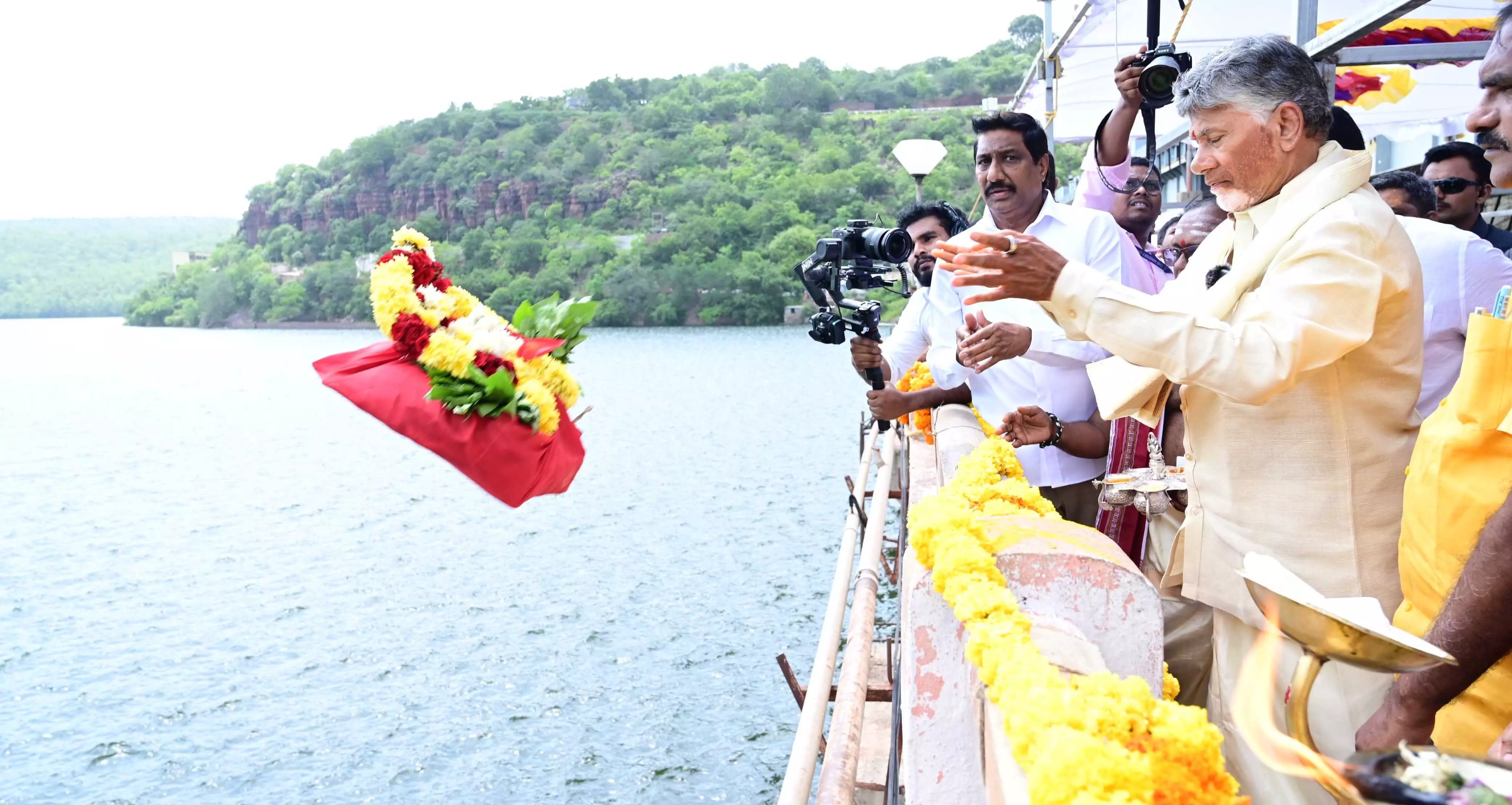 Naidu Offers Jala Harathi, Opens Srisailam Gates amid Heavy Inflows