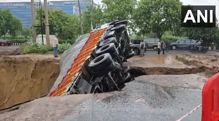 Truck Carrying Liquor Falls into Crater After Road Collapses in Rain-Hit Gurugram