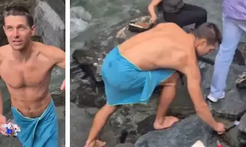Foreign Tourist Picks Up Trash at Himachal Waterfall, Sparks Civic Sense Debate Foreign Tourist Picks Up Trash at Himachal Waterfall, Sparks Civic Sense Debate