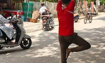 Man Protested For Pothole Repair By Doing Yoga Asana In It, GHMC Repairs It In Hours