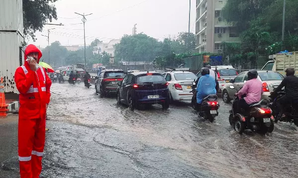Cops Brave Floods To Aid Hyderabad City