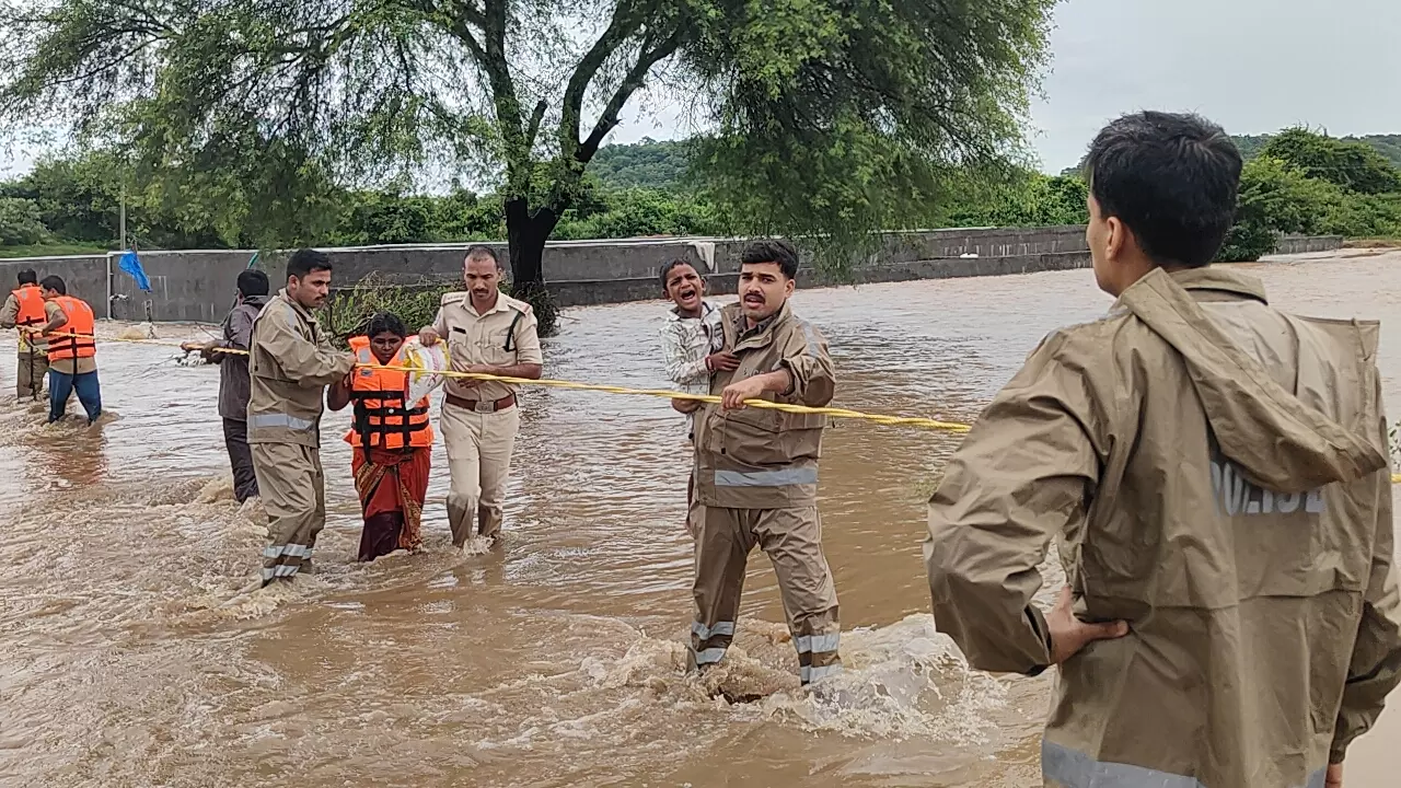 6 Family Members Stuck in Flood Water Rescued In Adilabad