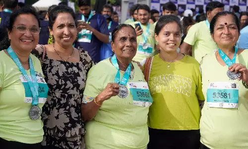 Every Finish Line, A New Beginning 8K Runners Light Up NMDC Marathon