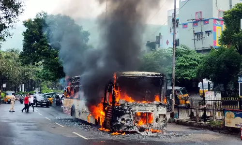 APSRTC Bus Gutted in Fire Near Petrol Pump in Visakhapatnam; All Passengers Safe APSRTC Bus Gutted in Fire Near Petrol Pump in Visakhapatnam; All Passengers Safe