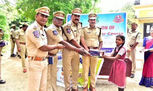 Students Receive Educational Material From Police Students Receive Educational Material From Police