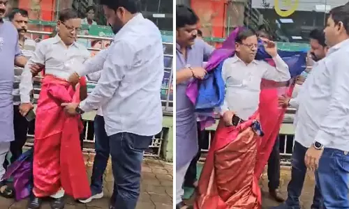 Congress Worker Posts Morphed Photo Of PM, BJP Workers Force Him To Wear Saree