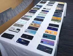 Police Return 100 Stolen Mobiles Police Return 100 Stolen Mobiles