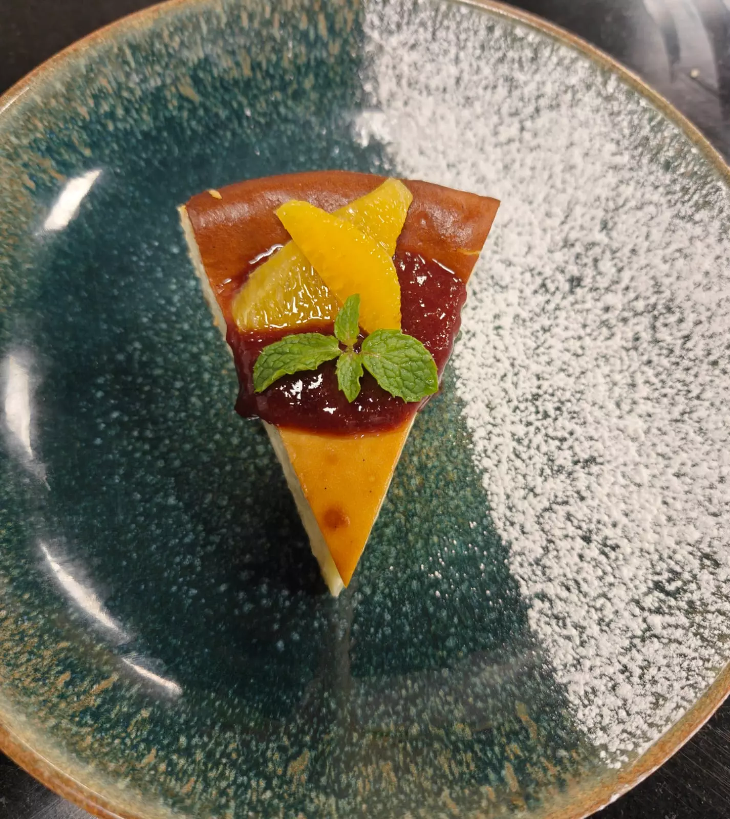 Indulge in a Decadent Basque Cheesecake with Fresh Strawberry Coulis