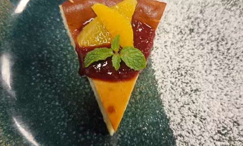 Indulge in a Decadent Basque Cheesecake with Fresh Strawberry Coulis