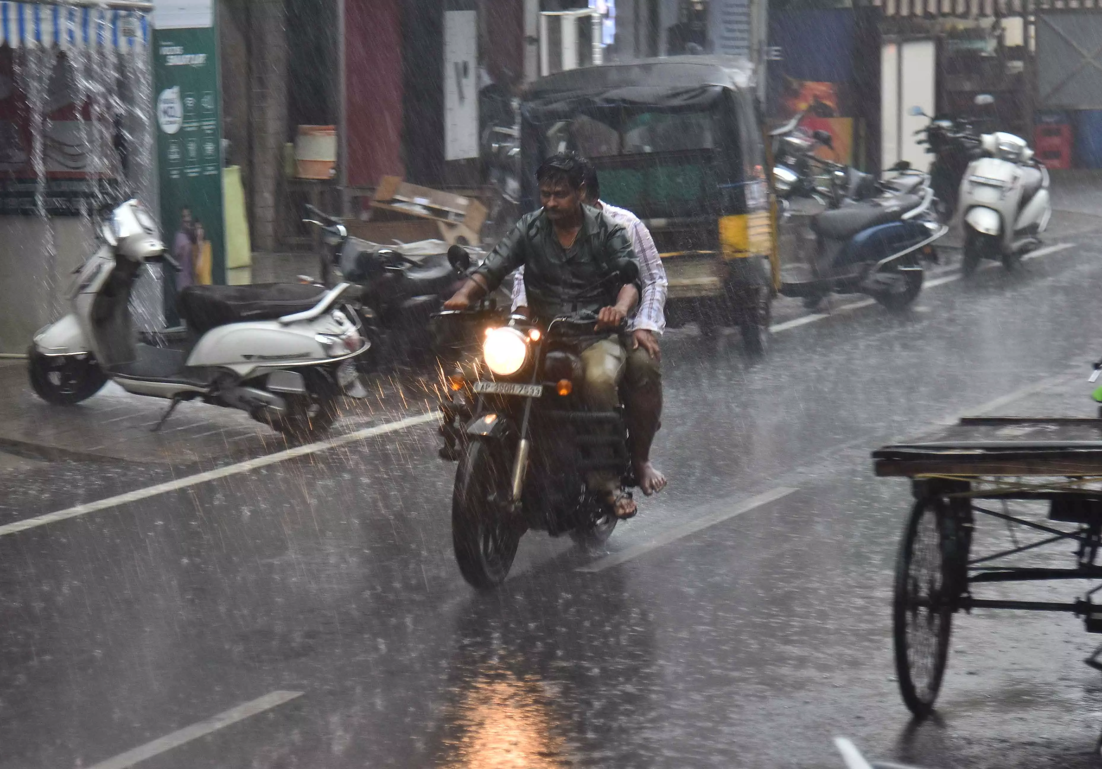 Sudden Showers Drench Hyderabad After Clear Skies