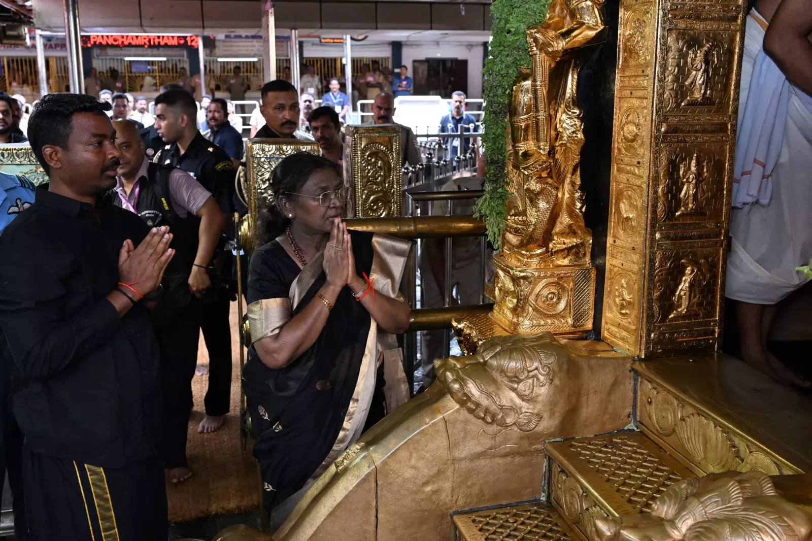 President Murmus Sabarimala Visit Photo Sparks Controversy