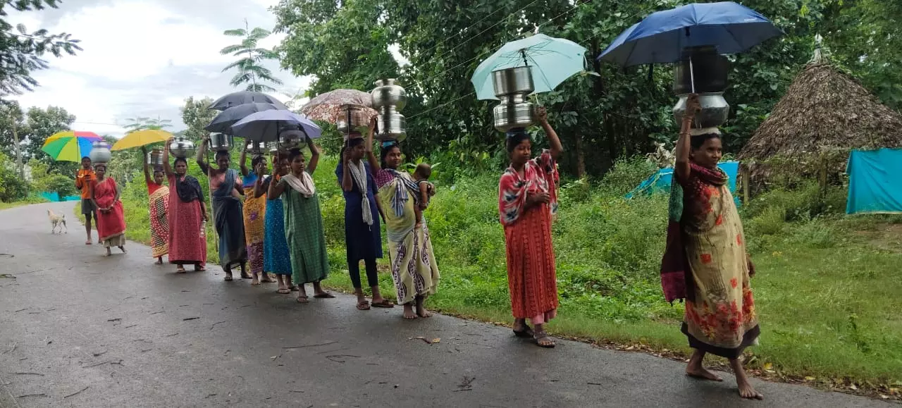 PVTG Women Brave Cyclone to Fetch Drinking Water PVTG Women Brave Cyclone to Fetch Drinking Water