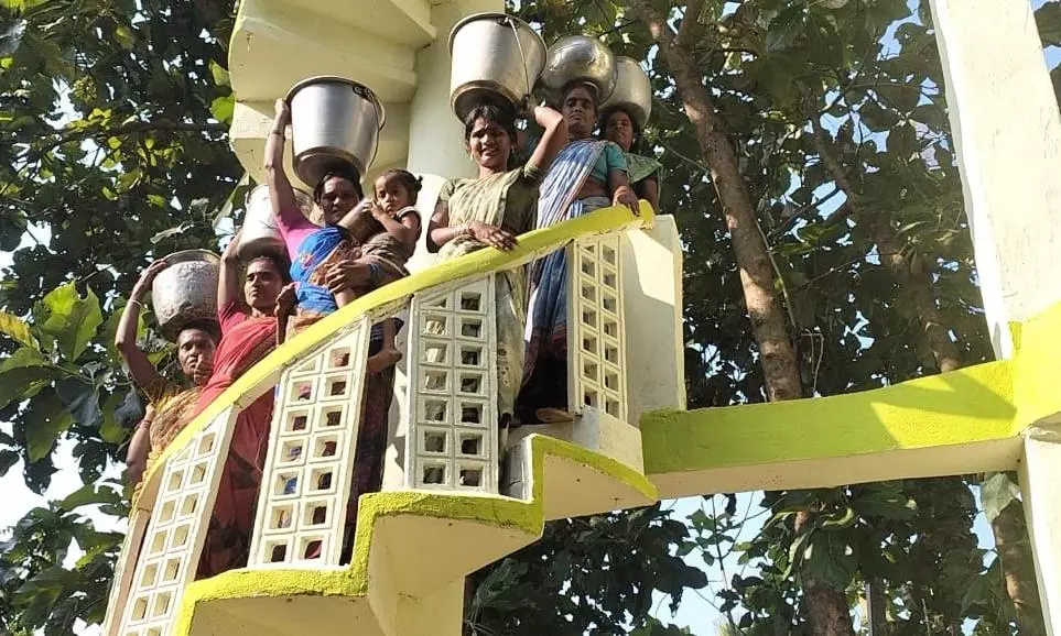 Gollapeta Tribal Women Climb Water Tank With Empty Pots