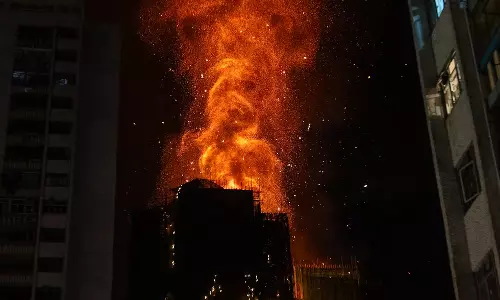 The Fire Jumped Building to Building: Residents Recall Fear as Hong Kong Blaze Kills 55