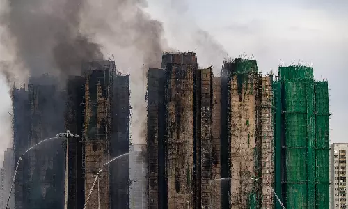 Hong Kong Firefighters Make Final Search; Tower Fire Toll Rises to 128