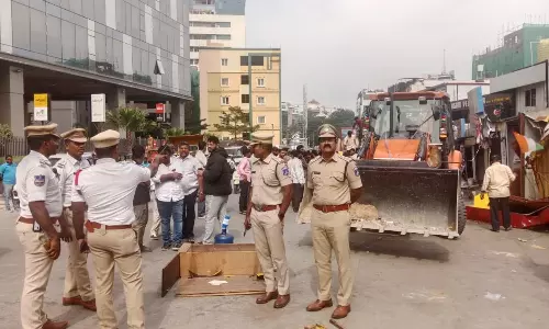 Madhapur Police, GHMC Clear Footpath Encroachments in Hitec City