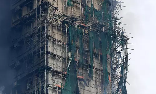 Hong Kong Arrests More Suspects in Fire Probe as Death Toll Hits 151 Hong Kong Arrests More Suspects in Fire Probe as Death Toll Hits 151