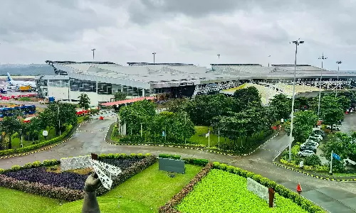 Rival Slogans at Mangaluru Airport Amid Power-Sharing Buzz Rival Slogans at Mangaluru Airport Amid Power-Sharing Buzz