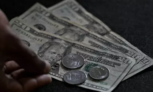 Rupee closes at record low of 90.73 Against US Dollar