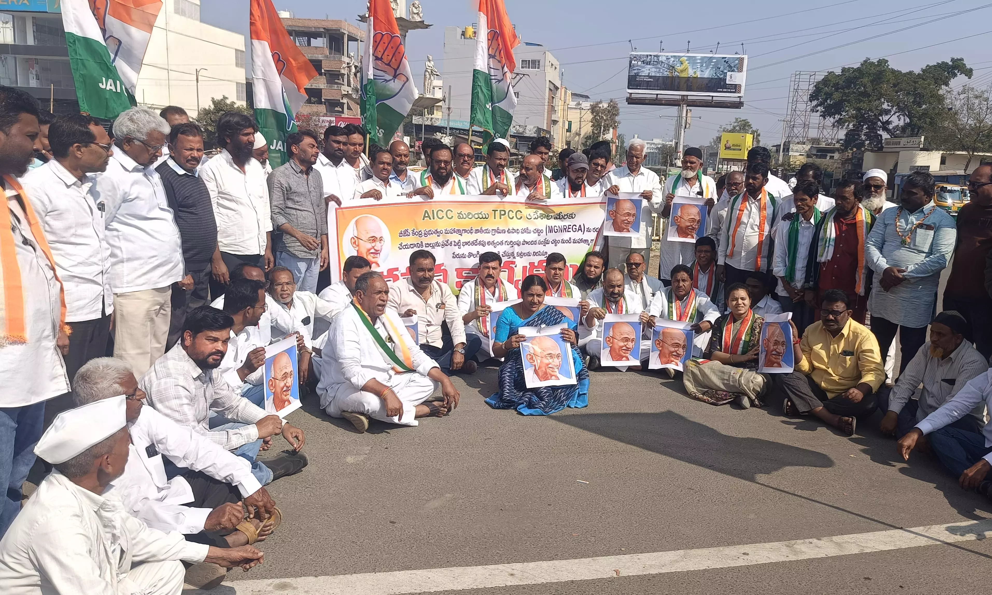 Congress Protests Removal of ‘Gandhi’ Name from MGNREGS in Adilabad Congress Protests Removal of ‘Gandhi’ Name from MGNREGS in Adilabad