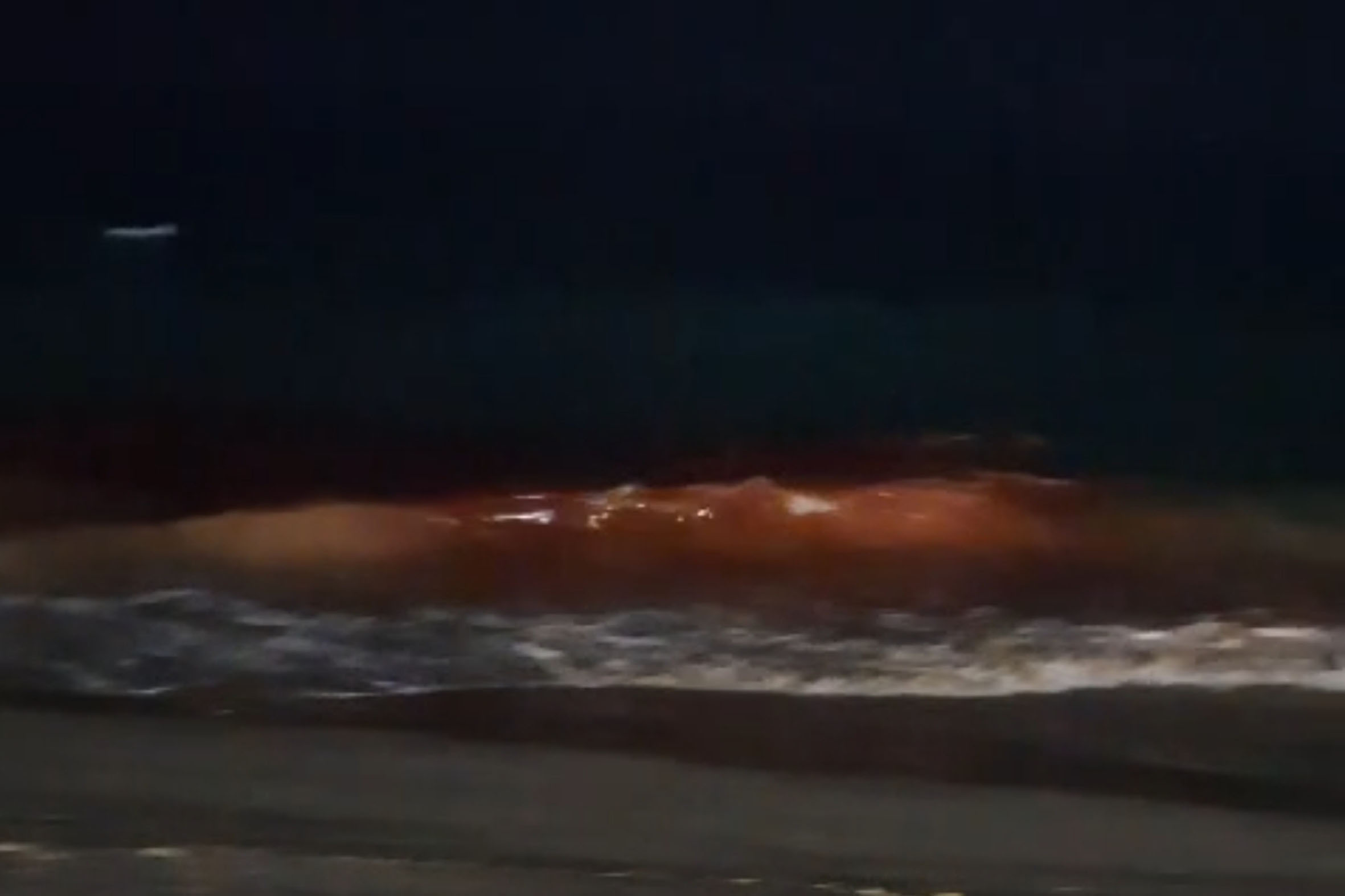 Red Waves Glow at RK Beach in Vizag