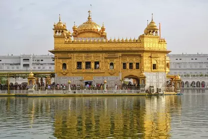 SGPC Asks Pilgrims to Remove CM Mann Photo ID Cards at Golden Temple SGPC Asks Pilgrims to Remove CM Mann Photo ID Cards at Golden Temple