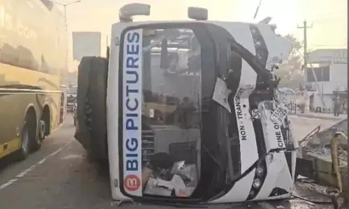Film Unit Bus Overturns After Hitting Divider Near Pedda Amberpet