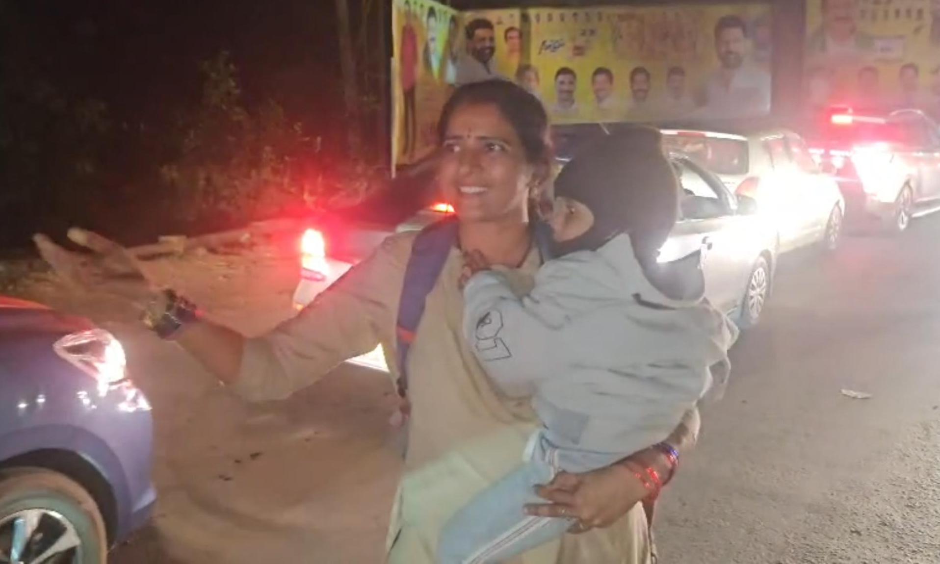 Woman Cop Clears Traffic for Ambulances with Toddler