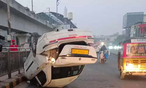 Close Shave For Techie As Car Overturns On Begumpet Flyover