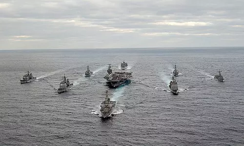 Trump Warns Iran as Armada Moves In, Urges Tehran to Make Deal