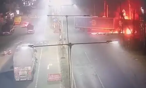 Driver Burnt Alive As Container Vehicle Catches Fire After Crash Near Kathipudi Driver Burnt Alive As Container Vehicle Catches Fire After Crash Near Kathipudi
