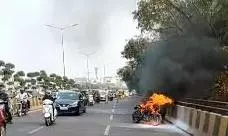 Traffic Chaos on Durgam Cheruvu Cable Bridge as Bike Catches Fire Traffic Chaos on Durgam Cheruvu Cable Bridge as Bike Catches Fire