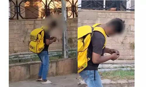 Viral Video Shows Intoxicated Delivery Worker Standing in One Spot for Hours
