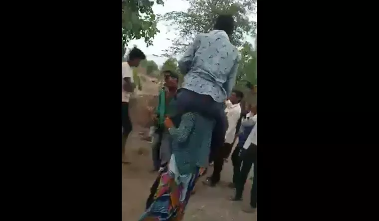MP: Woman, Accused Of Eloping With Another Man, Paraded With Hubby On Shoulders, Her Head Tonsured In MP Village MP: Woman, Accused Of Eloping With Another Man, Paraded With Hubby On Shoulders, Her Head Tonsured In MP Village