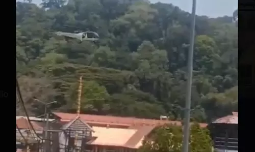 Police Register Case After Coast Guard Helicopter Flies Low Over Sabarimala Ayyappa Shrine Police Register Case After Coast Guard Helicopter Flies Low Over Sabarimala Ayyappa Shrine