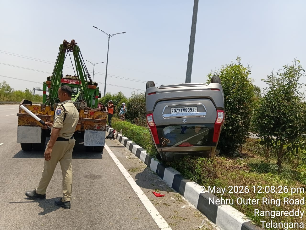 4 Injured as Car Overturns on ORR in Tukkuguda