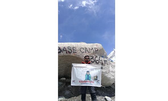 Tribal Youth Displays ITDA Officer Portrait at Everest Base Camp