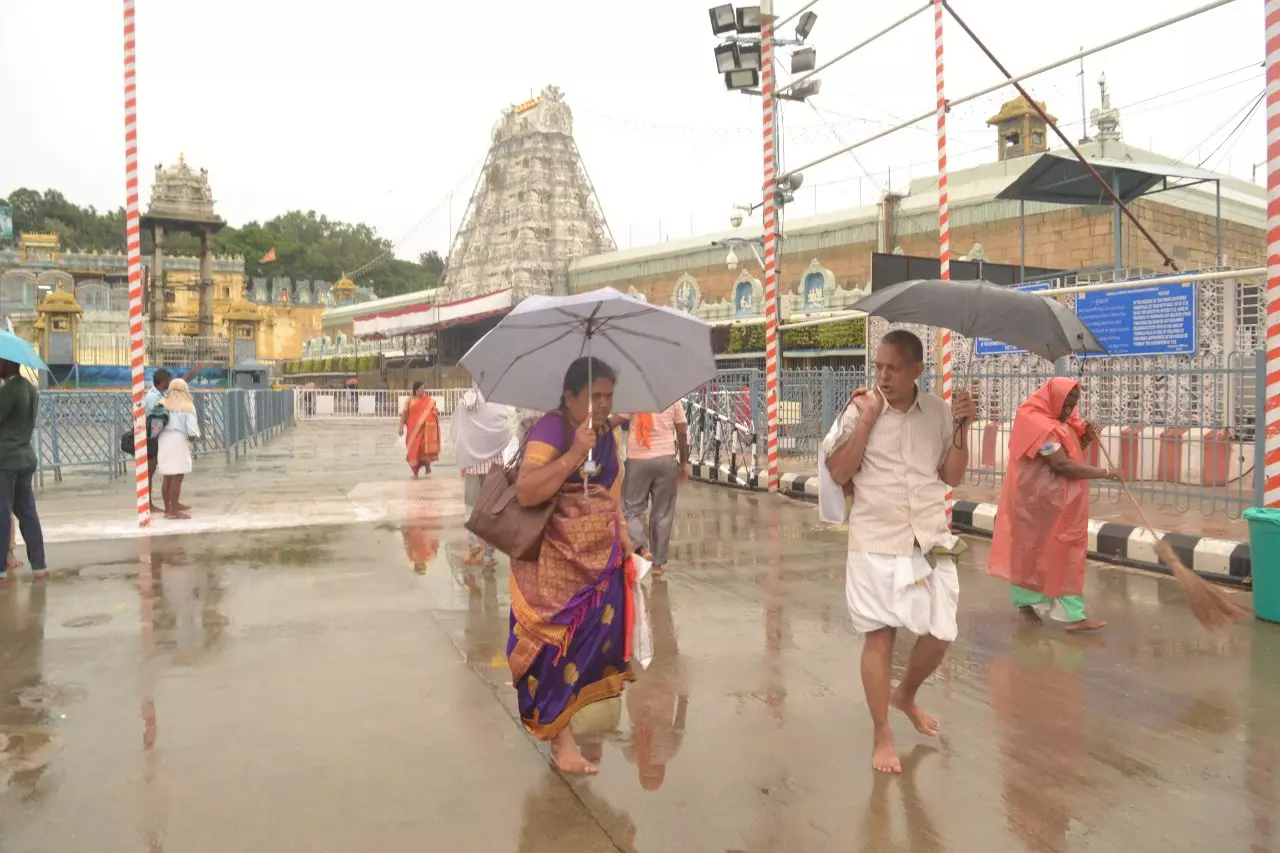 Rain Disrupts Life In Tirumala, Tirupati; Provides Relief To Devotees Rain Disrupts Life In Tirumala, Tirupati; Provides Relief To Devotees