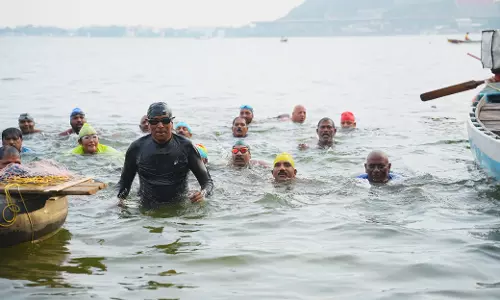 Collector Swims Across Krishna to Spread Environment Message Collector Swims Across Krishna to Spread Environment Message