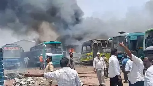 Seven Buses Gutted in Major Fire at Auto Nagar in Vijayawada Seven Buses Gutted in Major Fire at Auto Nagar in Vijayawada