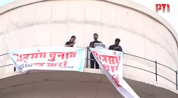 NSUI Workers Climb Water Tank in Jaipur Over Students Union Polls NSUI Workers Climb Water Tank in Jaipur Over Students Union Polls