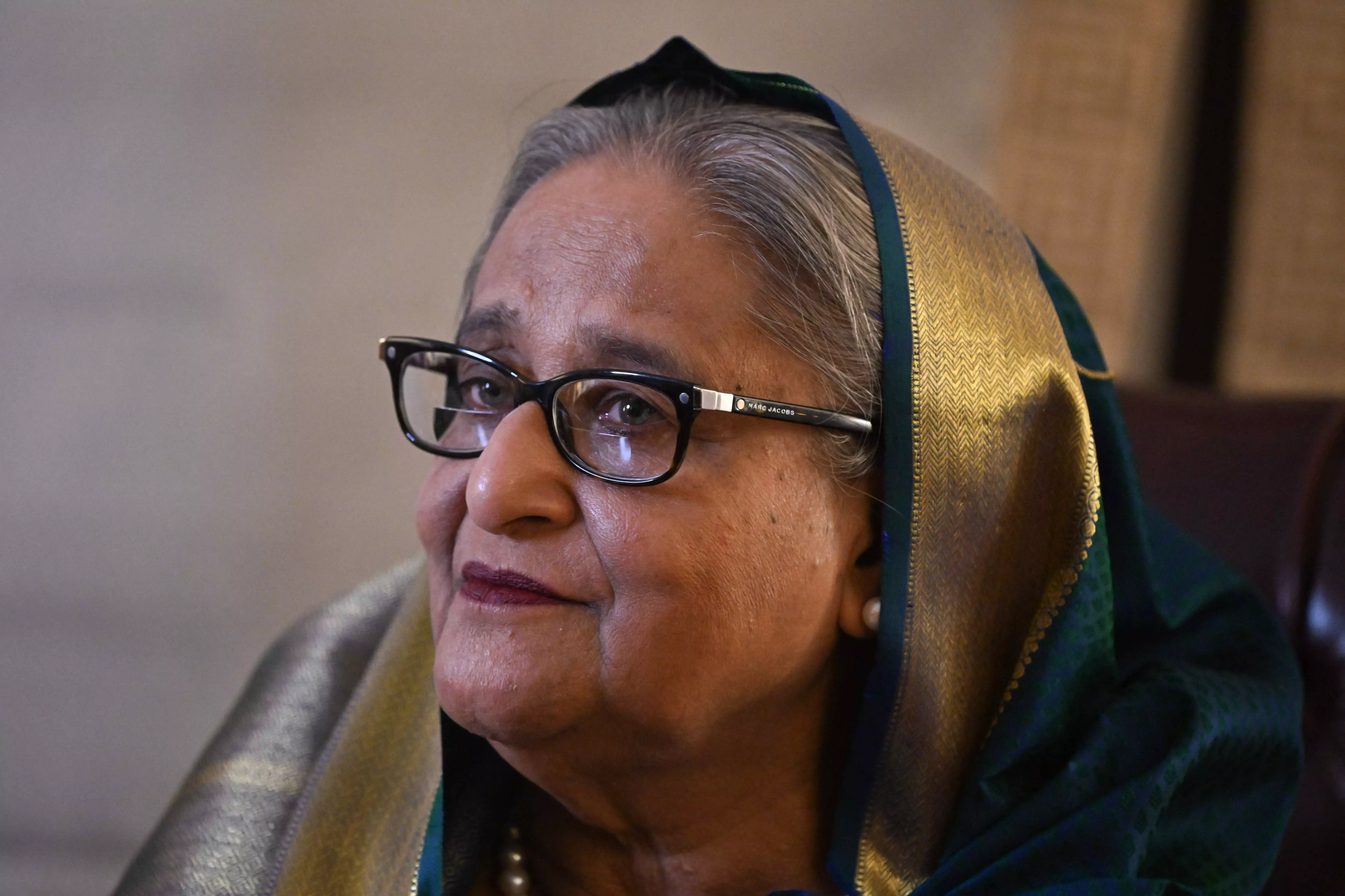 Hasina Vows Bangladesh Return Despite Jail Risk