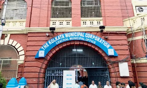 KMC, Cops Remove TMC Signboard From Abhisheks Office Amidst Fight KMC, Cops Remove TMC Signboard From Abhisheks Office Amidst Fight