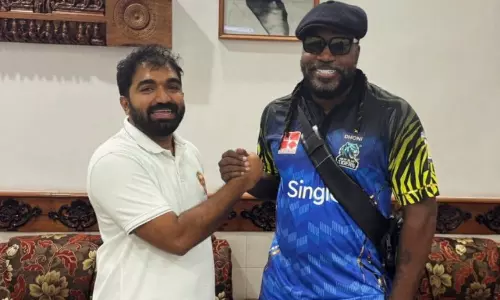 Chris Gayle pays floral tribute at Oommen Chandys tomb in Kottayam Chris Gayle pays floral tribute at Oommen Chandys tomb in Kottayam