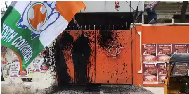 Youth Cong Activists Protest at BJP Office in Hyderabad, Throw Black Colour at Rear Gate Youth Cong Activists Protest at BJP Office in Hyderabad, Throw Black Colour at Rear Gate